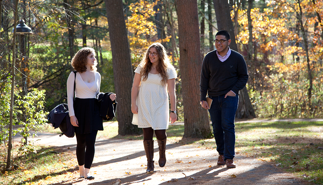 Students walking on path in fall