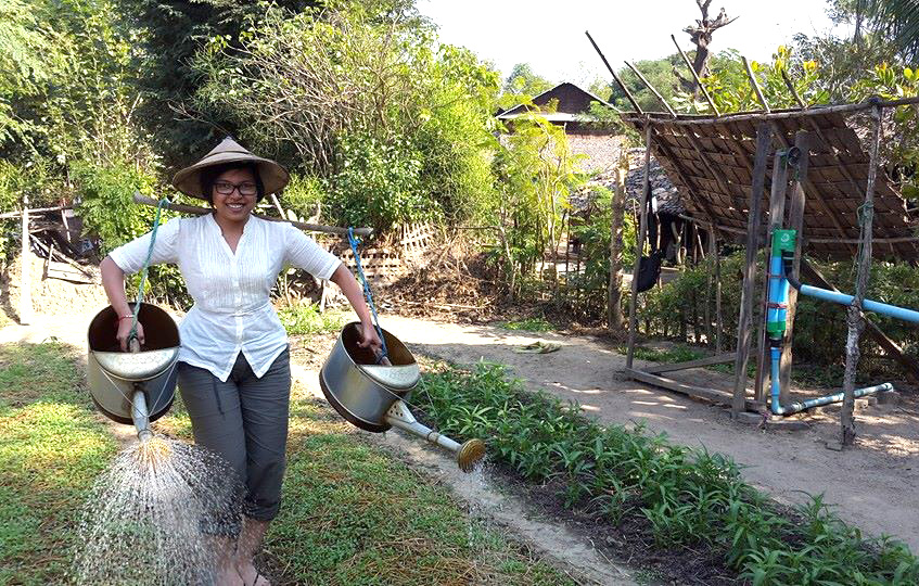 Phyu Hninn Nyein with watering can