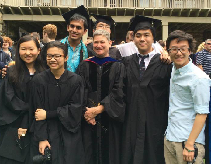 Eldred Lee with fellow graduates and professor