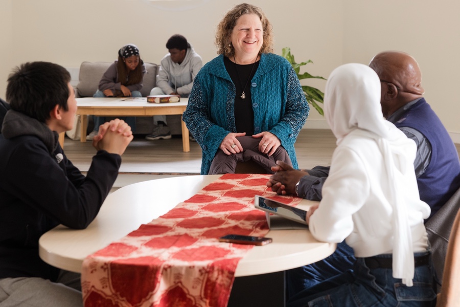 Simon's Rock students and faculty member converse