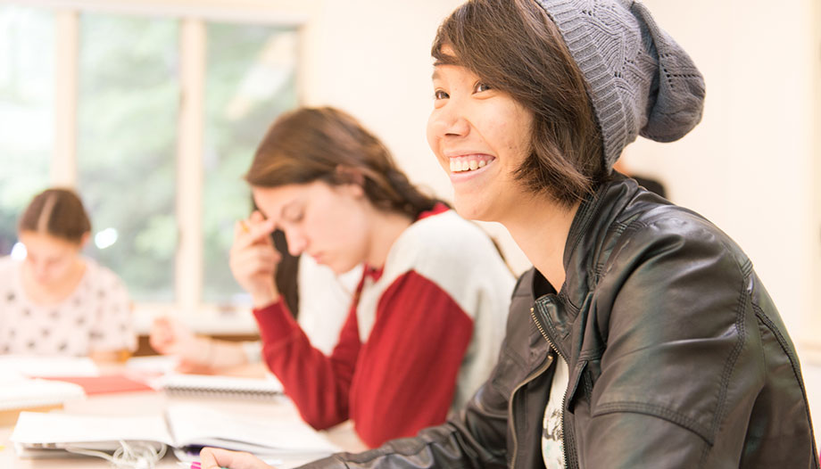 Smiling student in Young Writers Workshop