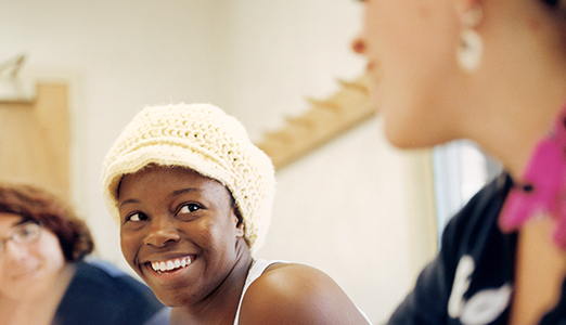 A student smiles in class.