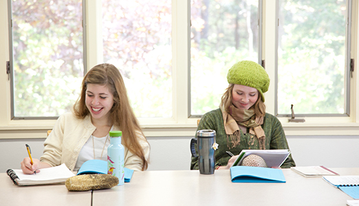 Two female students in classrooms