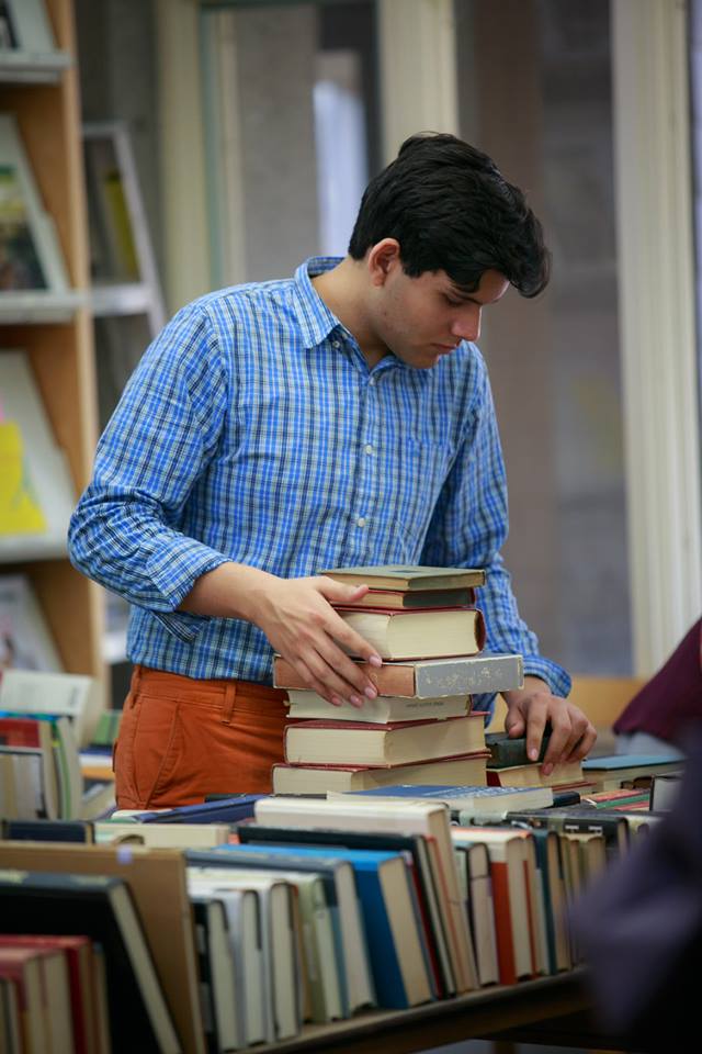 A patron browsing at the library's annual book sale.