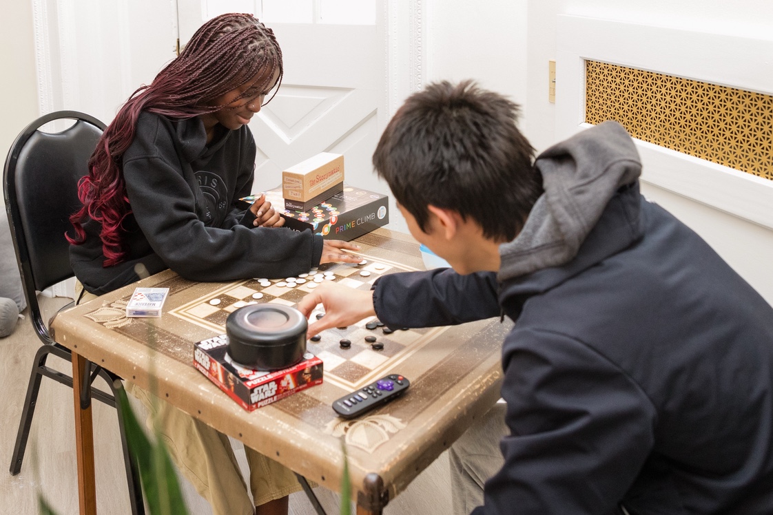Students playing board games