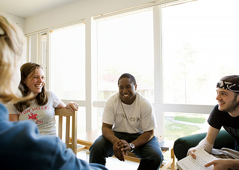 Students explore ideas in classroom discussion.